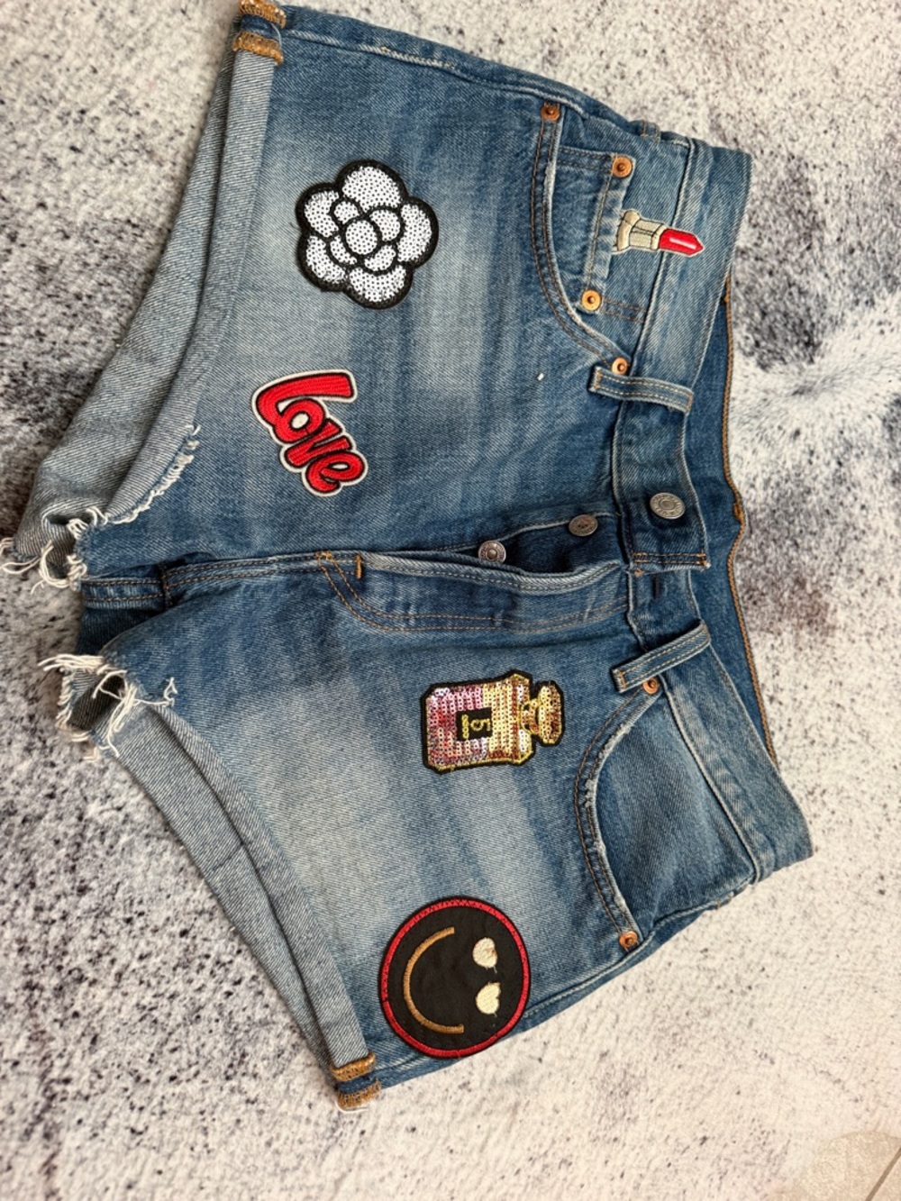 Levi's Blue Denim Cutoff Shorts with Playful Patches
